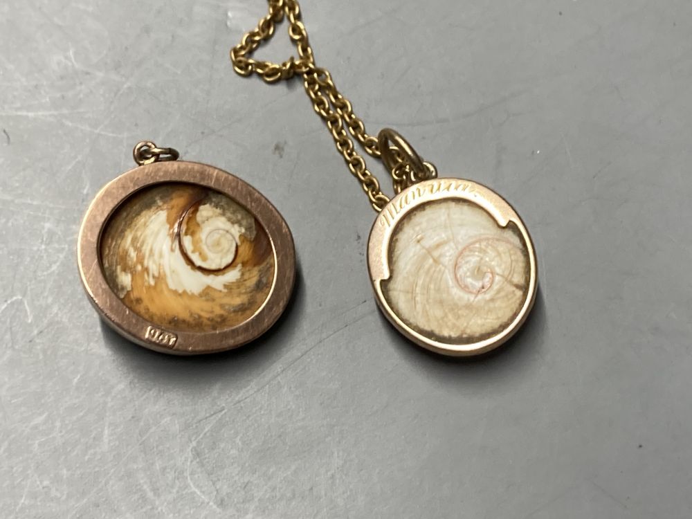 Two yellow metal-mounted shell pendants, a moonstone ring , a similar pair of drop earrings and a mourning brooch,